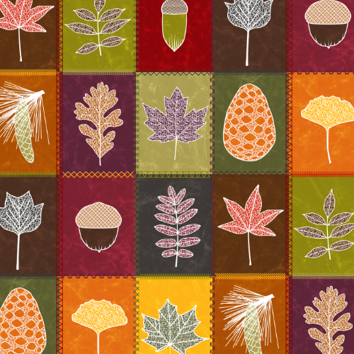 A pattern of block of color with different leaves in center and all are in fall colors